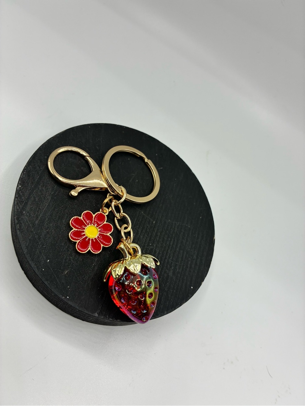 Gold-Tone Keychain with Red Flower and Iridescent Strawberry Charms